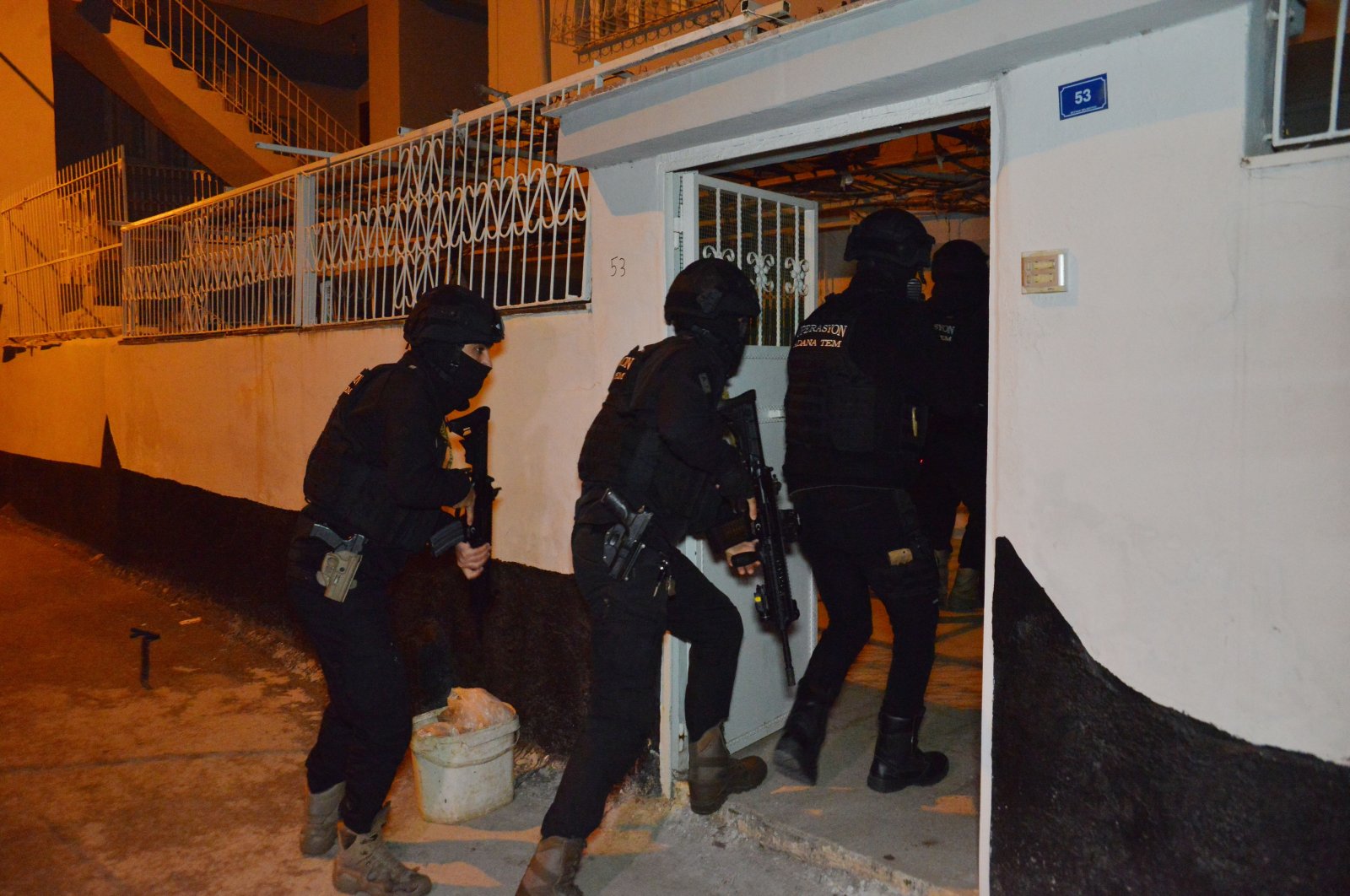 Counterterrorism squads enter the home of a PKK terrorist suspect in Adana, Turkey, Feb. 14, 2022. (DHA Photo)