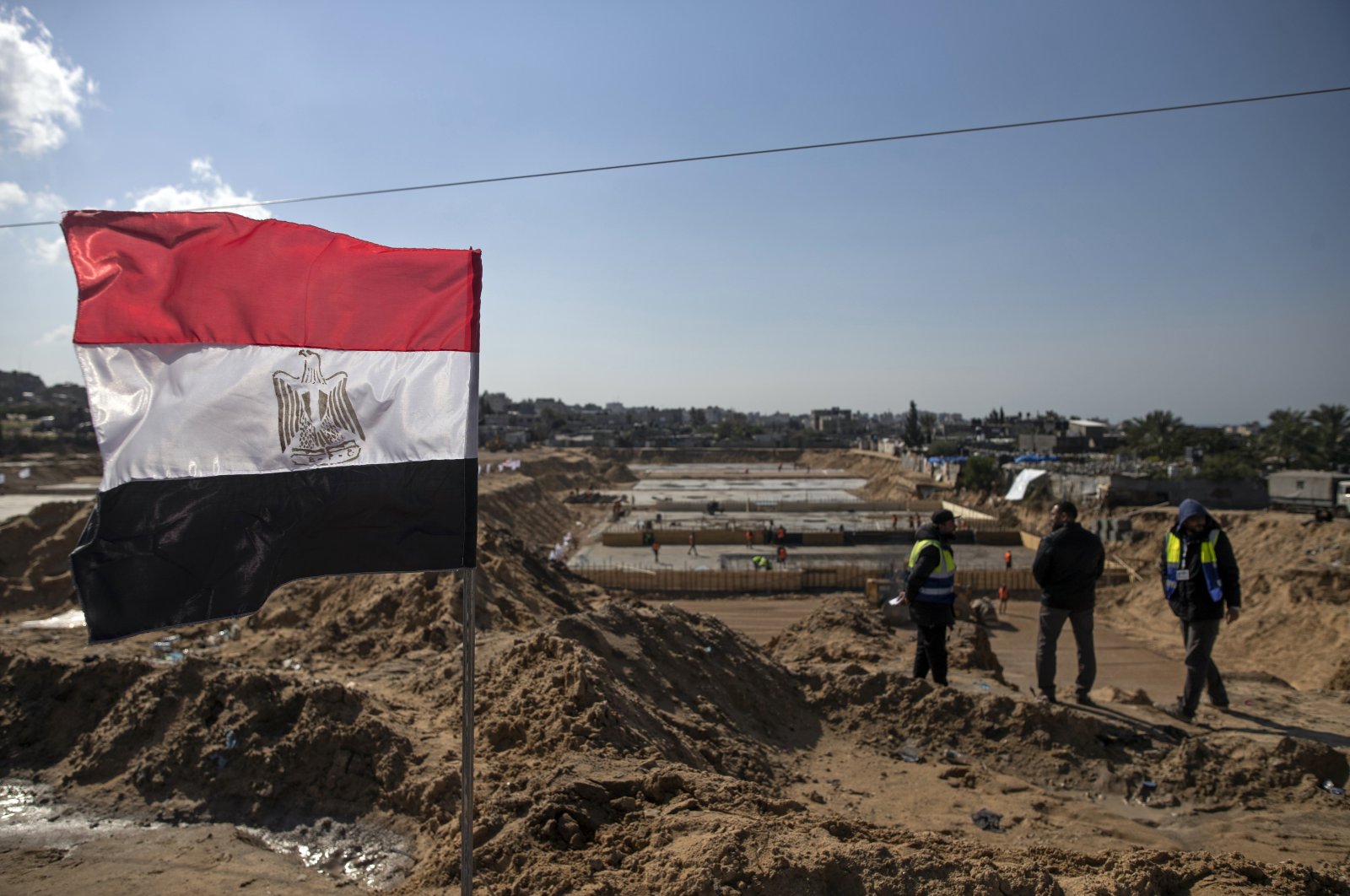 Laborers work on concrete slab foundations for one of three Egyptian-funded housing complexes in the Gaza Strip, in the town of Beit Lahiya, northern Gaza, Palestine, Jan. 25, 2022. (AP Photo)
