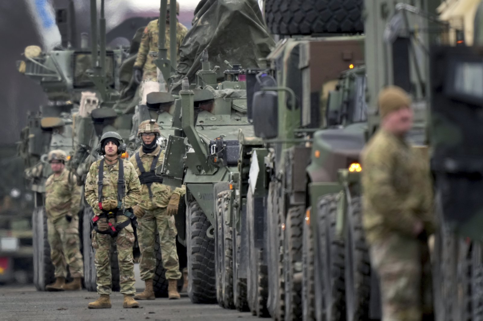 U.S. soldiers of the 2nd Cavalry Regiment line up vehicles at the military airfield in Vilseck, Germany, Feb. 9, 2022. (AP Photo)