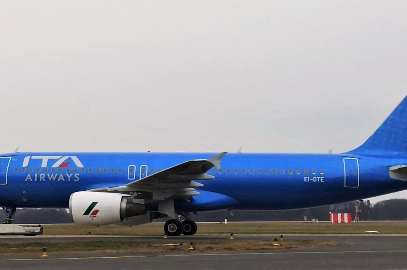 A new state-owned Italian carrier Italia Trasporto Aereo (ITA Airways) plane with the new blue livery dedicated to the Italian football player Paolo Rossi, is seen at Fiumicino airport, in Rome, Italy, Dec. 24, 2021. (Reuters Photo)