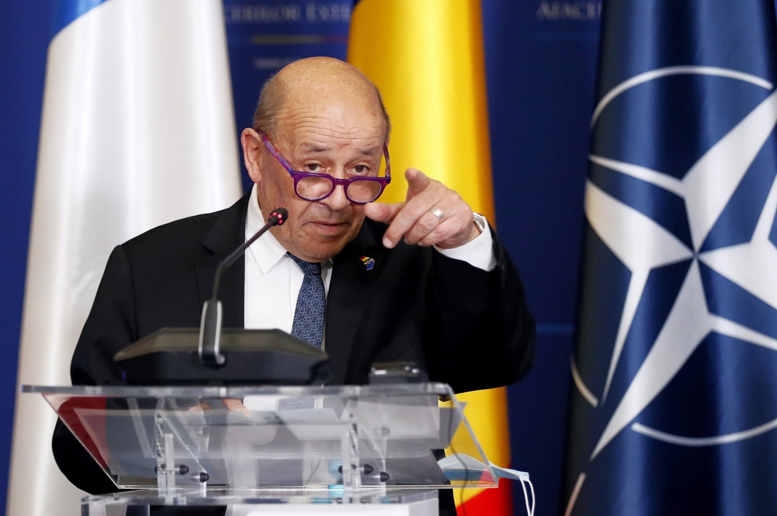 Jean-Yves Le Drian, French minister for Europe and Foreign Affairs, accompanied by the Romanian Foreign Minister, gestures before answering a journalist&#039;s question at the end of a common statement that followed their B9 meeting held at Foreign Ministry headquarters in Bucharest, Romania, Feb. 3, 2022. (EPA Photo)