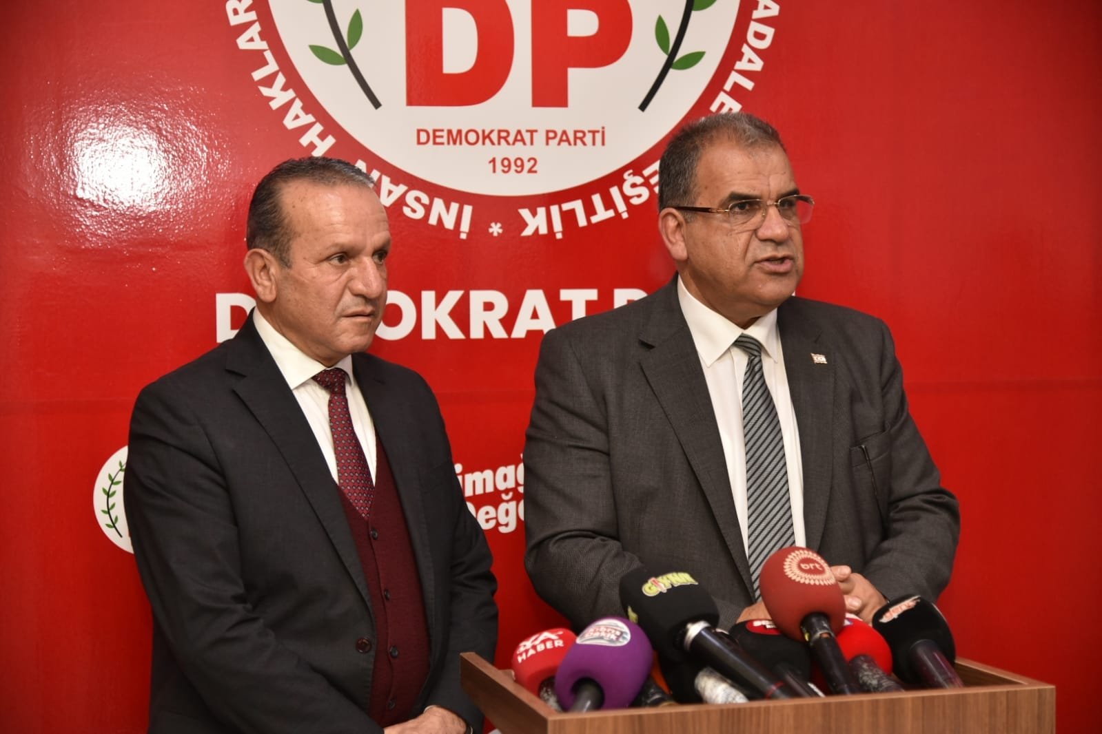 Prime Minister of the Turkish Republic of Northern Cyprus (TRNC) Faiz Sucuoğlu (R) and Democratic Party Chairperson Fikri Ataoğlu come together in Nicosia (Lefkoşa), TRNC, Feb. 9, 2022. (AA Photo)