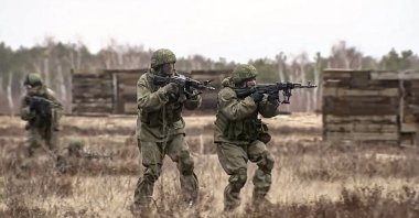 In this photo taken from video provided by the Russian Defense Ministry Press Service, Feb. 14, 2022, soldiers practice at the Obuz-Lesnovsky training ground during the Union Courage-2022 Russia-Belarus military drills in Belarus. (AP Photo)