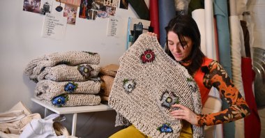 Minnesotan fashion designer Emma Gage of young label Melke works at her studio ahead of New York Fashion Week 2022, Feb. 4, 2022, New York City, U.S. (AFP Photo)