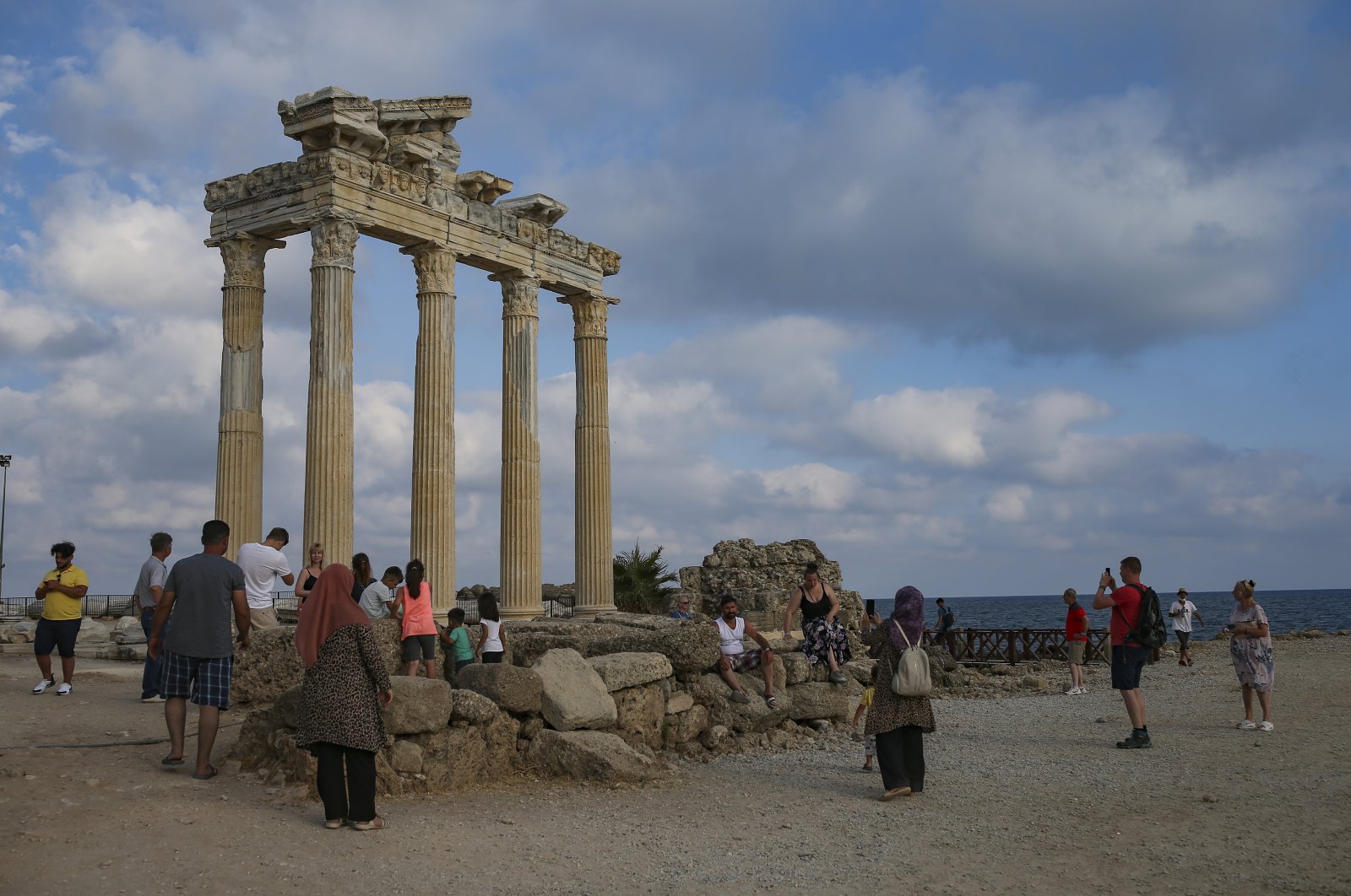 Tourists visit a historic temple in Antalya, southern Turkey, June 20, 2021. (AP Photo)