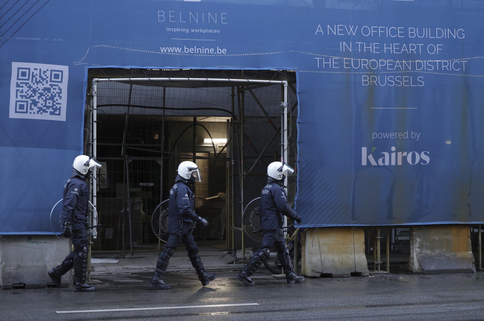 Police officers patrol in the EU quarters during a demonstration regarding COVID-19 restrictions in Brussels, Belgium, Feb. 14, 2022. (AP Photo)