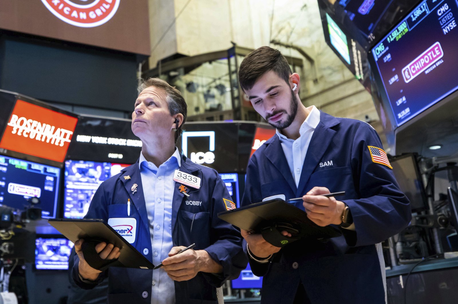 In this photo provided by the New York Stock Exchange, traders work on the floor, Tuesday, Feb. 15, 2022. (David L. Nemec/New York Stock Exchange via AP)