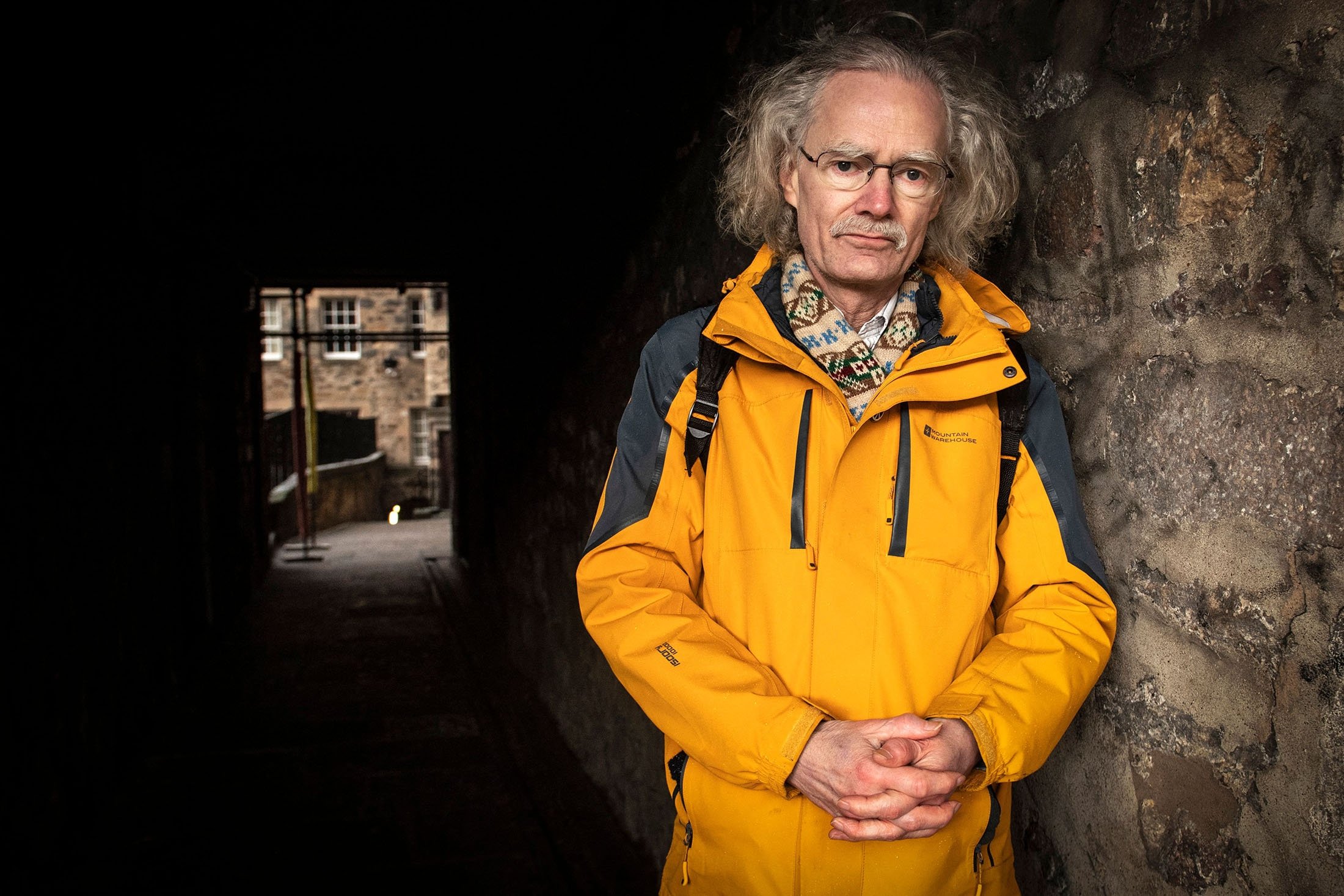 Emeritus professor of history at the University Of Edinburgh Julian Goodare, 64, poses for pictures on the Royal Mile, in Edinburgh, Scotland, Feb. 4, 2022. (AFP Photo)