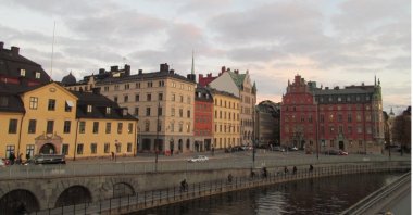 The colorful and ancient buildings of Stockholm are surrounded by a calm river. (Photo courtesy of Karin)