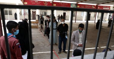 Yemenis stand in line at a food distribution center supported by the World Food Programme in Sanaa, Yemen, Feb. 16, 2022. (Reuters Photo)