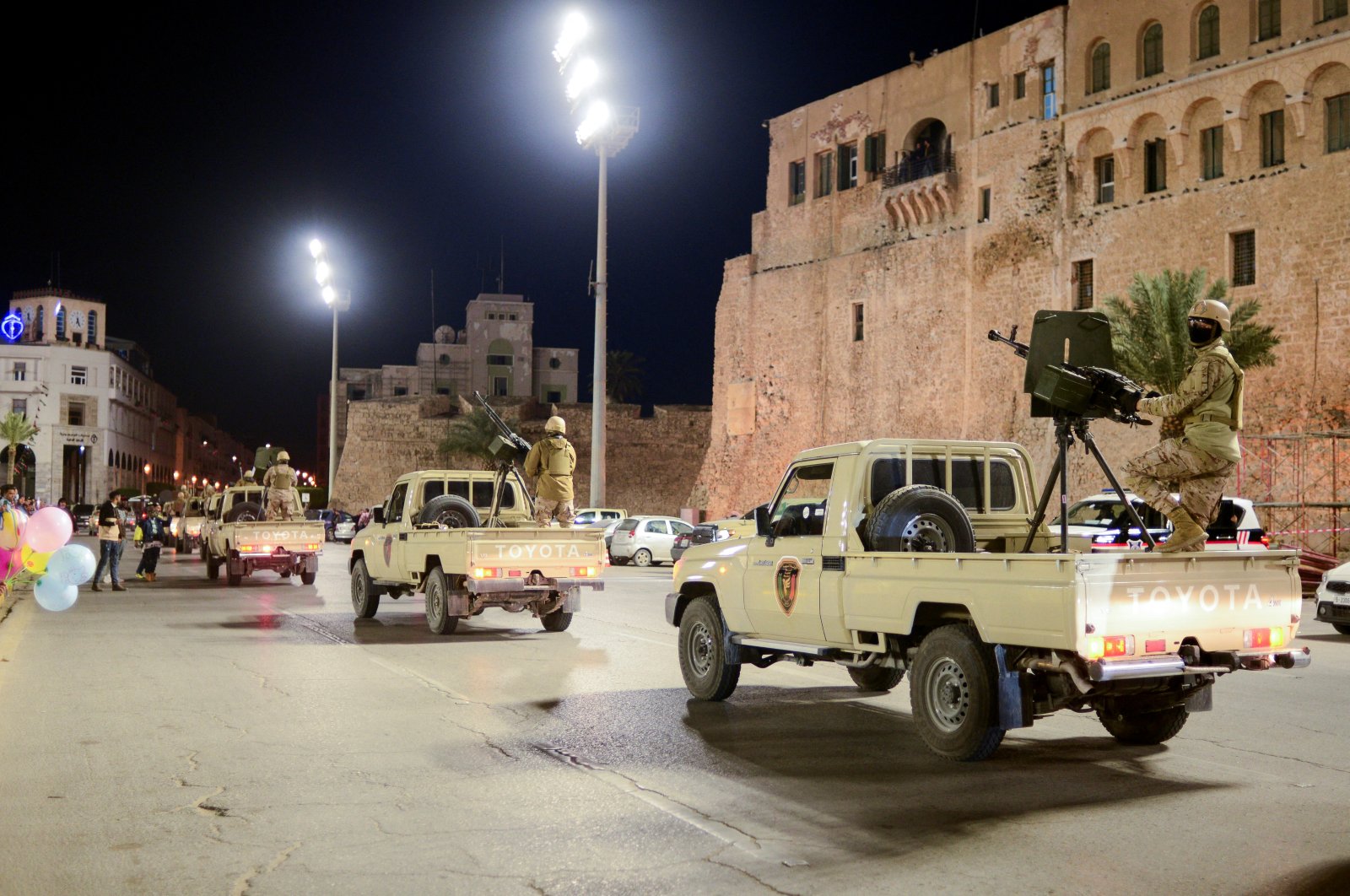 Members of the military personnel arrive to take part in a parade calling for parliamentary and presidential election, at Martyr&#039;s square in Tripoli, Libya, Feb. 12, 2022. (REUTERS Photo)