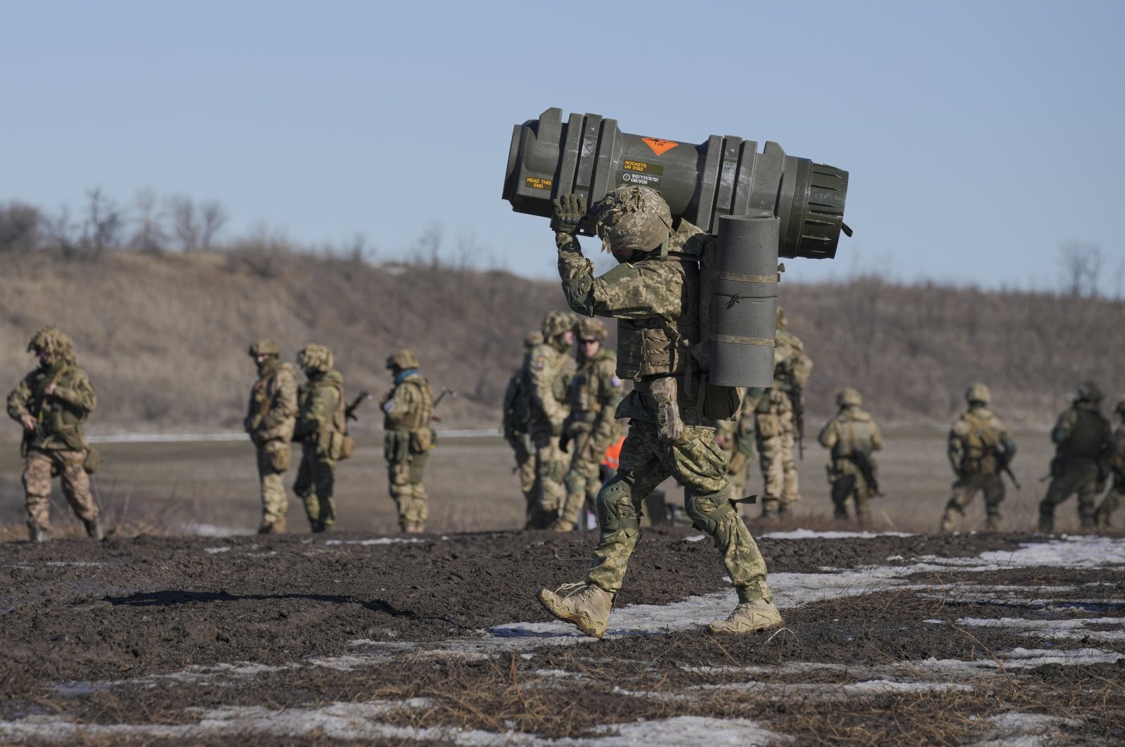 A Ukrainian serviceman carries an NLAW anti-tank weapon during an exercise in the Joint Forces Operation, in the Donetsk region, eastern Ukraine, Feb. 15, 2022. (AP Photo)