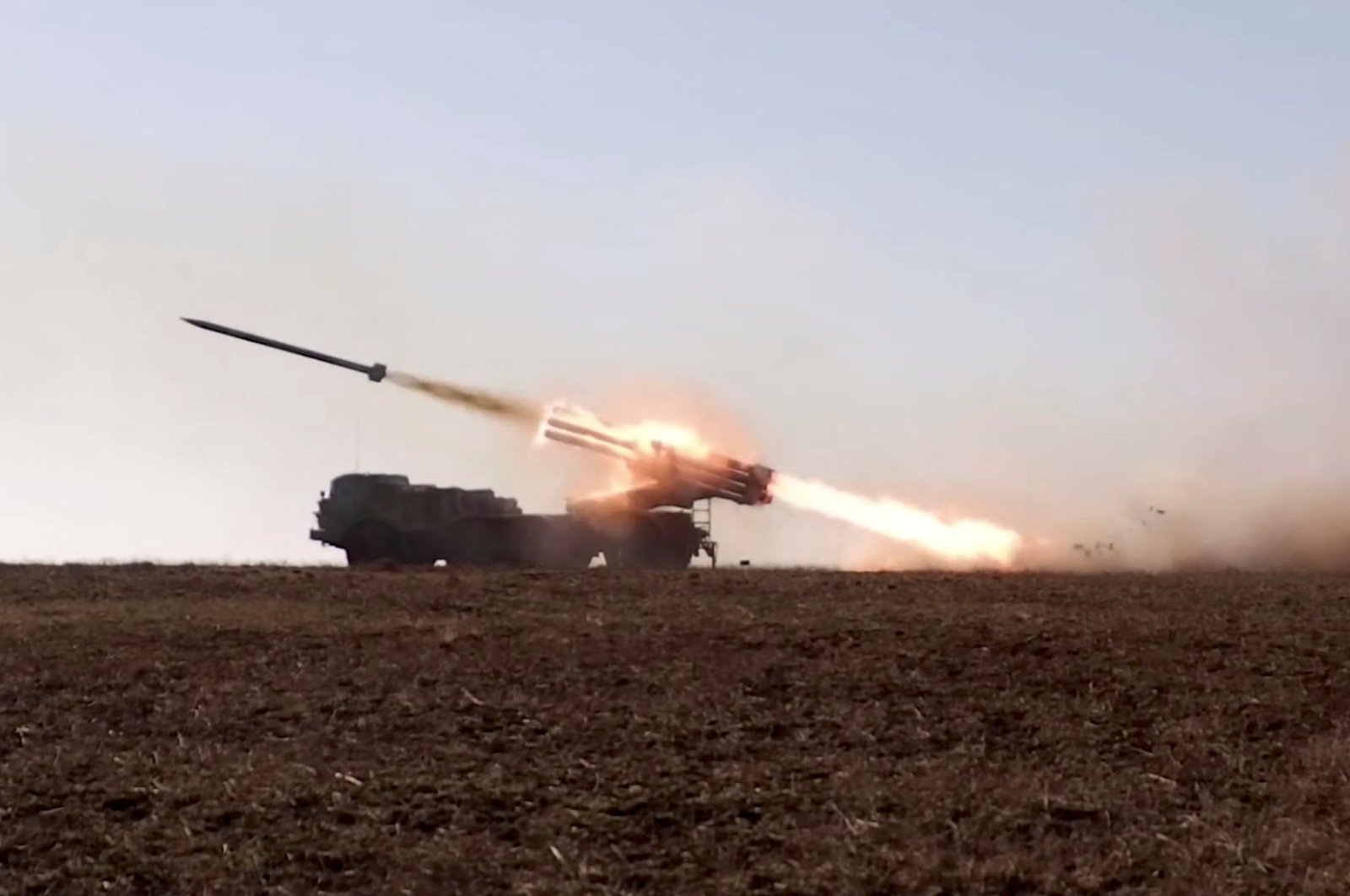 A Russian self-propelled multiple rocket launcher system launches a rocket during military exercises at the Opuk training area in Crimea, in this still image taken from a handout video released Feb. 15, 2022. (Russian Defense Ministry via Reuters)