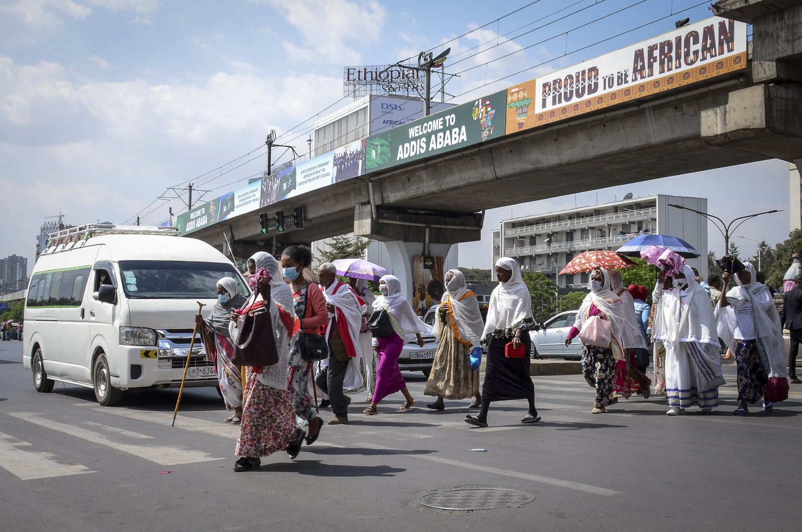 Pedestrians cross a street in downtown Addis Ababa, Ethiopia, Feb. 15, 2022. (AP Photo)