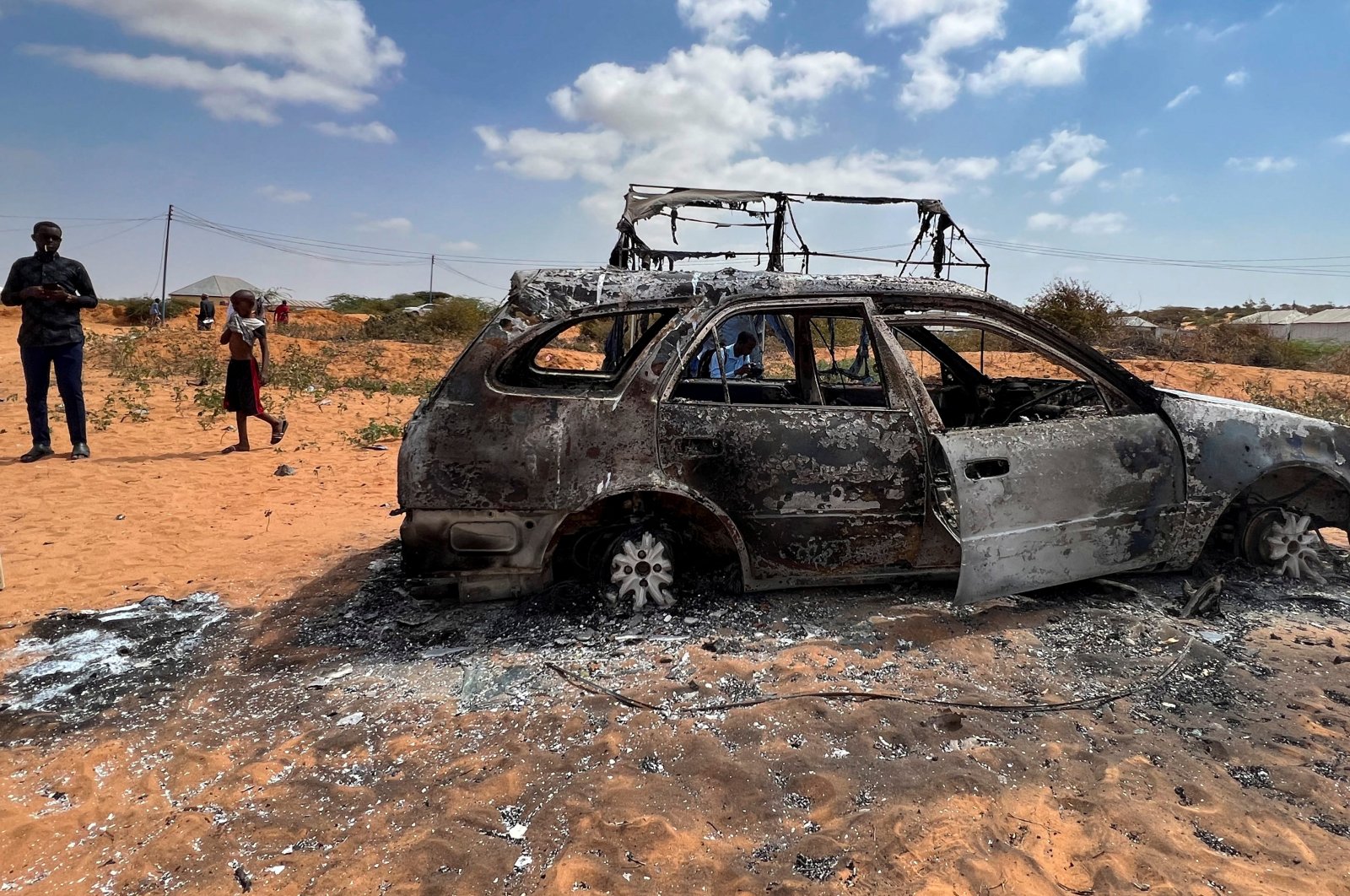 The wreckage of a burned car is seen following an overnight attack in Mogadishu, Somalia, Feb. 16, 2022. (Reuters Photo)