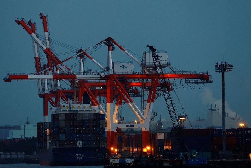 A cargo ship and containers are seen at an industrial port in Tokyo, Japan, Feb. 15, 2022. (Reuters Photo)