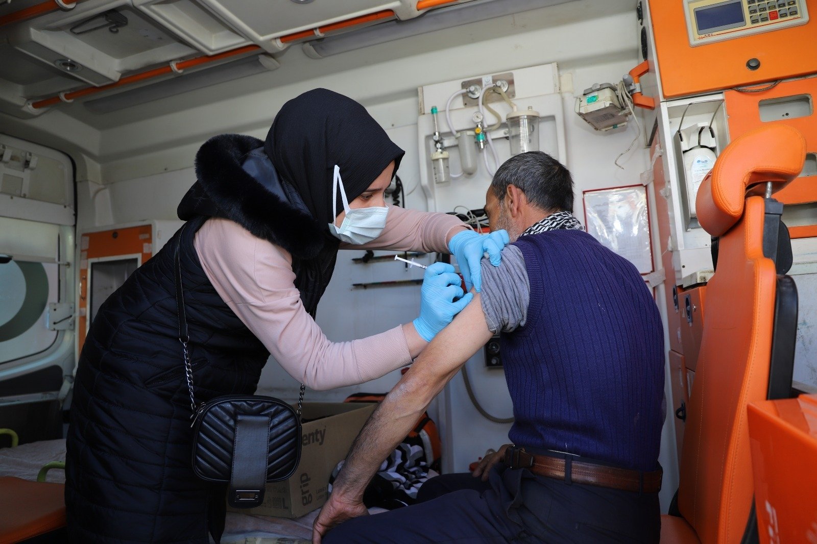 A man gets vaccinated against COVID-19 inside an ambulance, in Şanlıurfa, southeastern Turkey, Feb. 16, 2022. (AA Photo)