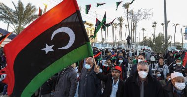 People gather in the coastal Libyan city of Tajura, east of the capital Tripoli on Feb. 16, 2022, as they commemorate the eve of the 11th anniversary of the uprising that toppled longtime strongman Moammar Gadhafi. (AFP Photo)
