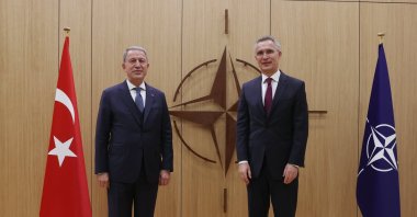 Defense Minister Hulusi Akar poses with NATO Secretary-General Jens Stoltenberg at the NATO headquarters in Brussels, Belgium, Feb. 16, 2022. (AA Photo)