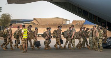 French Barkhane force soldiers who wrapped up a four-month tour of duty in the Sahel board a U.S. Air Force C130 transport plane, leave their base in Gao, Mali, June 9, 2021. (AP Photo)