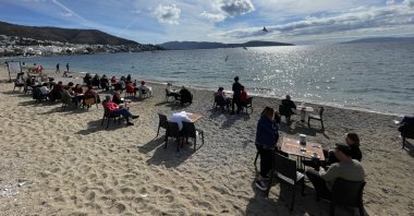 People admire the sea on a beach in Bodrum, Muğla, southwestern Turkey, Feb. 12, 2022. (AA Photo)