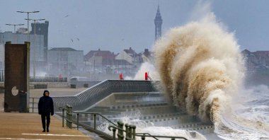 Waves crash on the seafront in Blackpool before Storm Dudley hits the north of England and southern Scotland, U.K., Feb. 16, 2022.  (AP Photo)