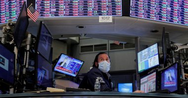 A specialist trader works inside a booth on the floor of the New York Stock Exchange (NYSE) in New York City, U.S., Jan. 18, 2022. (Reuters Photo)