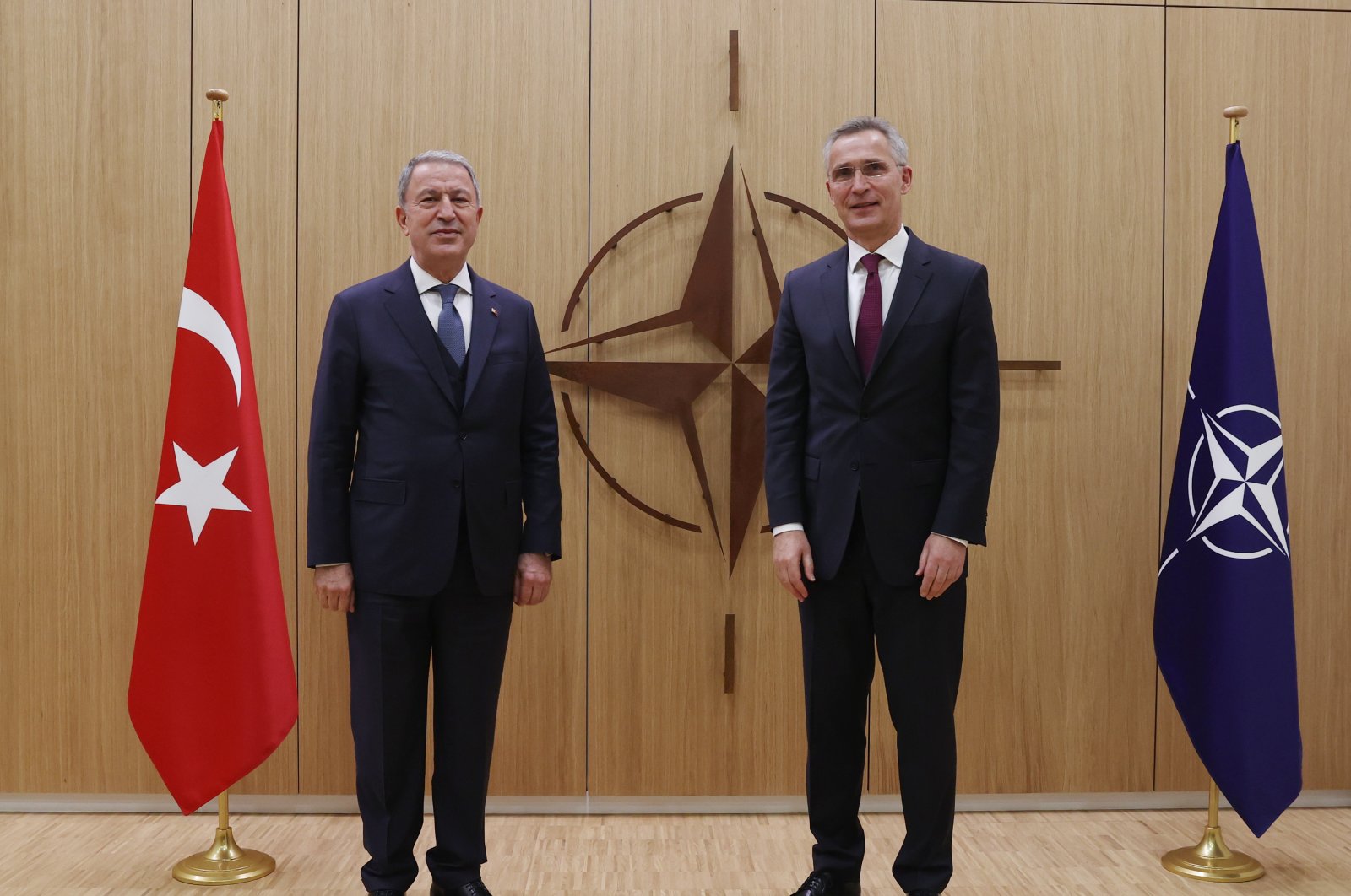 Defense Minister Hulusi Akar poses with NATO Secretary-General Jens Stoltenberg at the NATO headquarters in Brussels, Belgium, Feb. 16, 2022. (AA Photo)