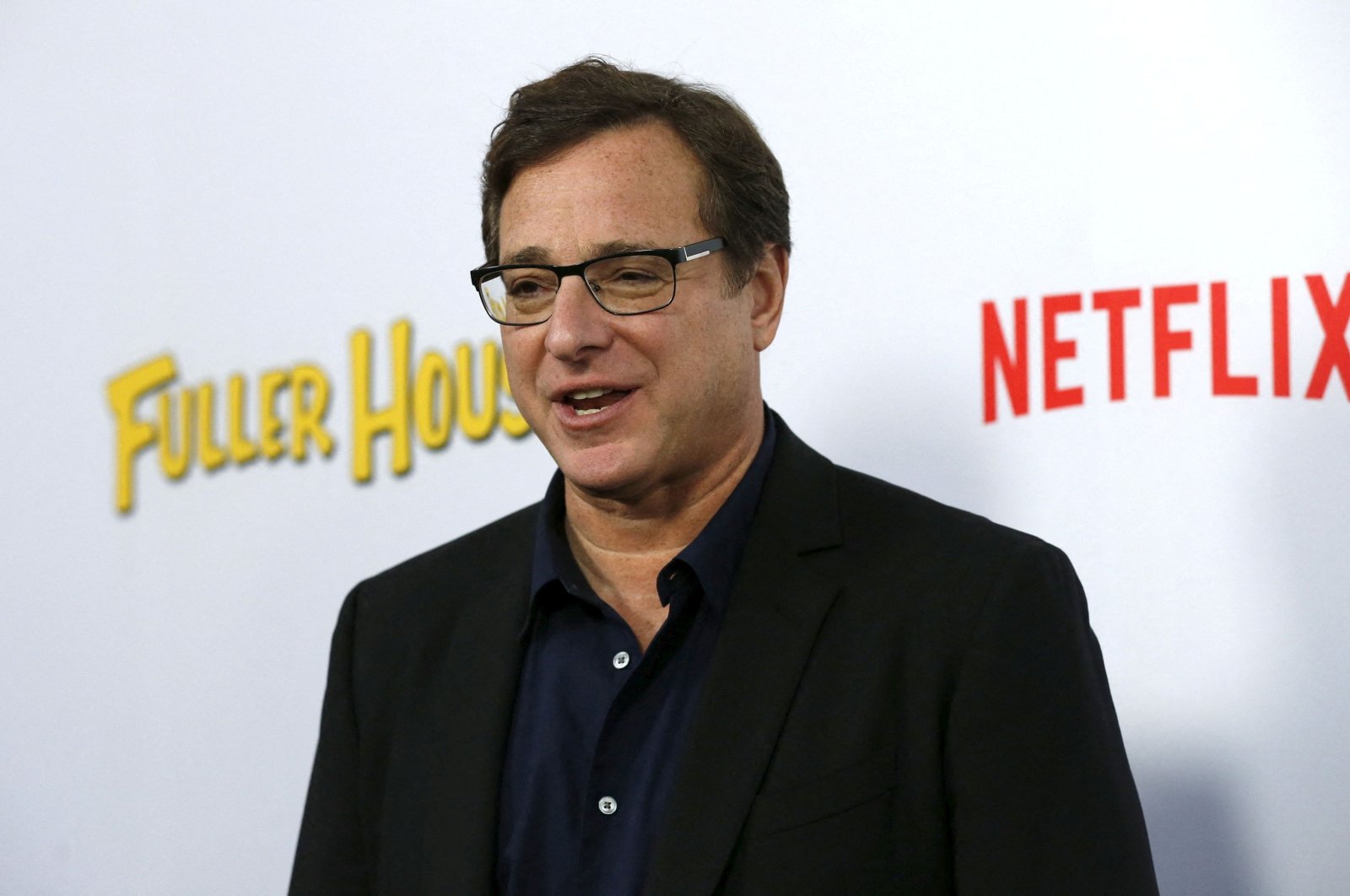 Cast member Bob Saget poses at the premiere for the Netflix television series &quot;Fuller House&quot; at The Grove in Los Angeles, California, Feb. 16, 2016.  (REUTERS)