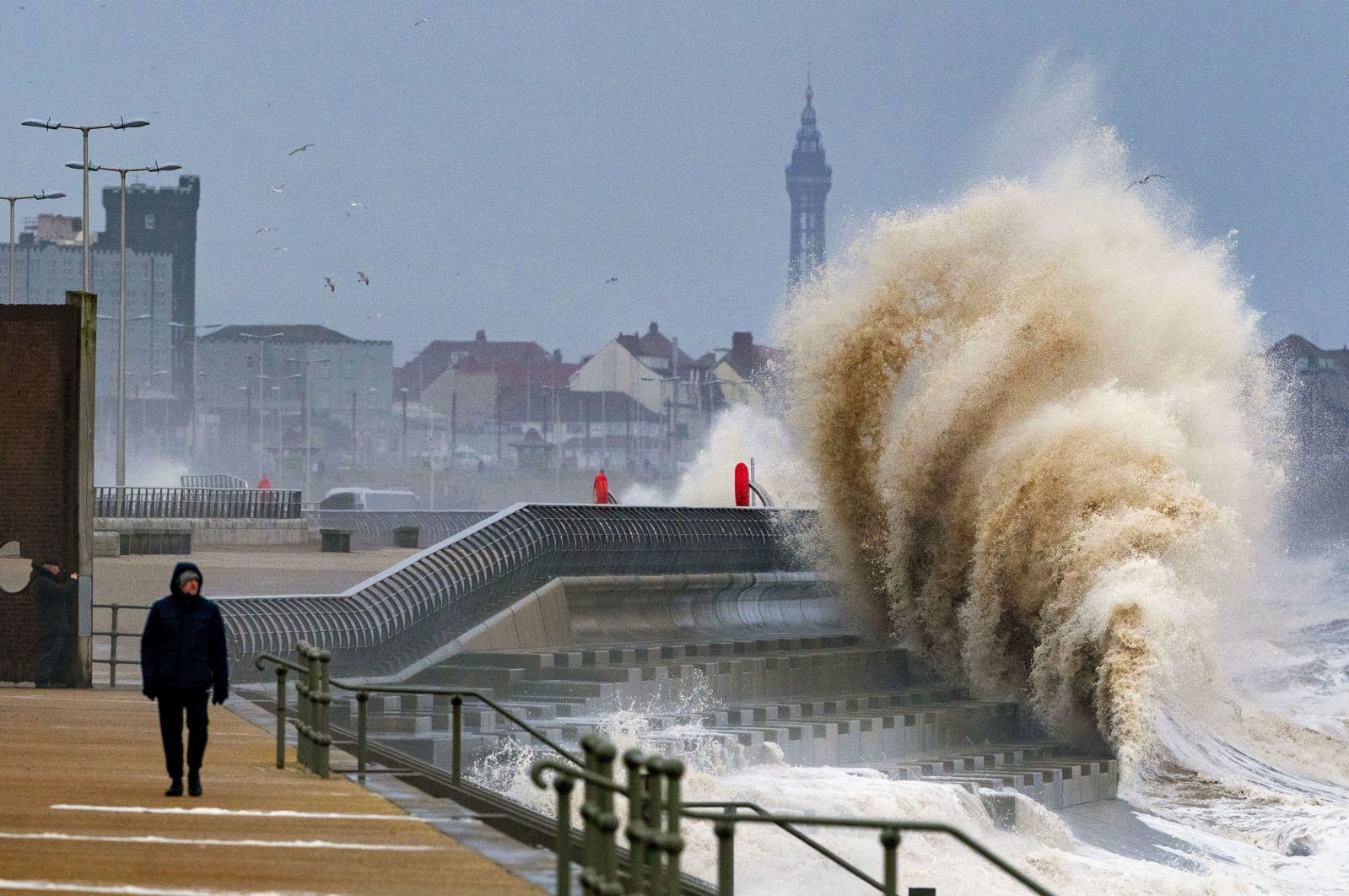 Waves crash on the seafront in Blackpool before Storm Dudley hits the north of England and southern Scotland, U.K., Feb. 16, 2022.  (AP Photo)