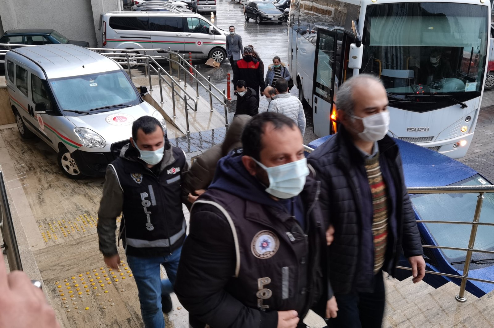 Police escort six detained FETÖ suspects to the courthouse, in Zonguldak, northern Turkey, Feb. 18, 2022. (IHA Photo)