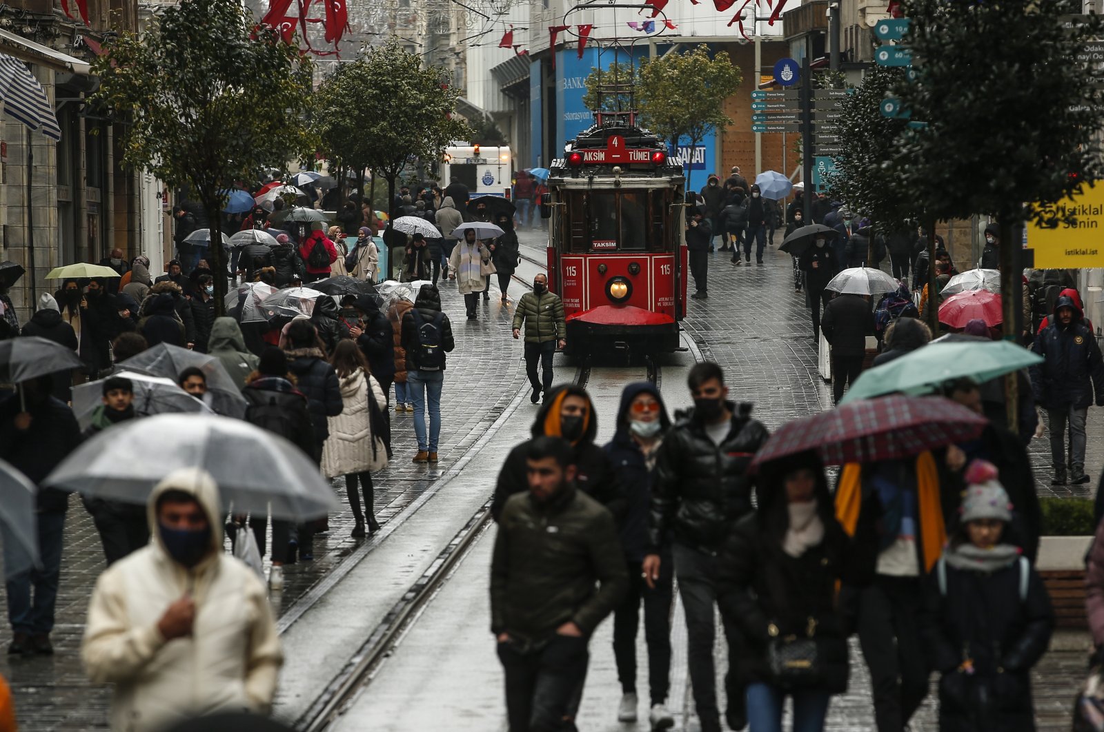 People walk along Istiklal Avenue, one of the main shopping streets in Istanbul, Turkey, Feb. 3, 2022. (AP Photo)