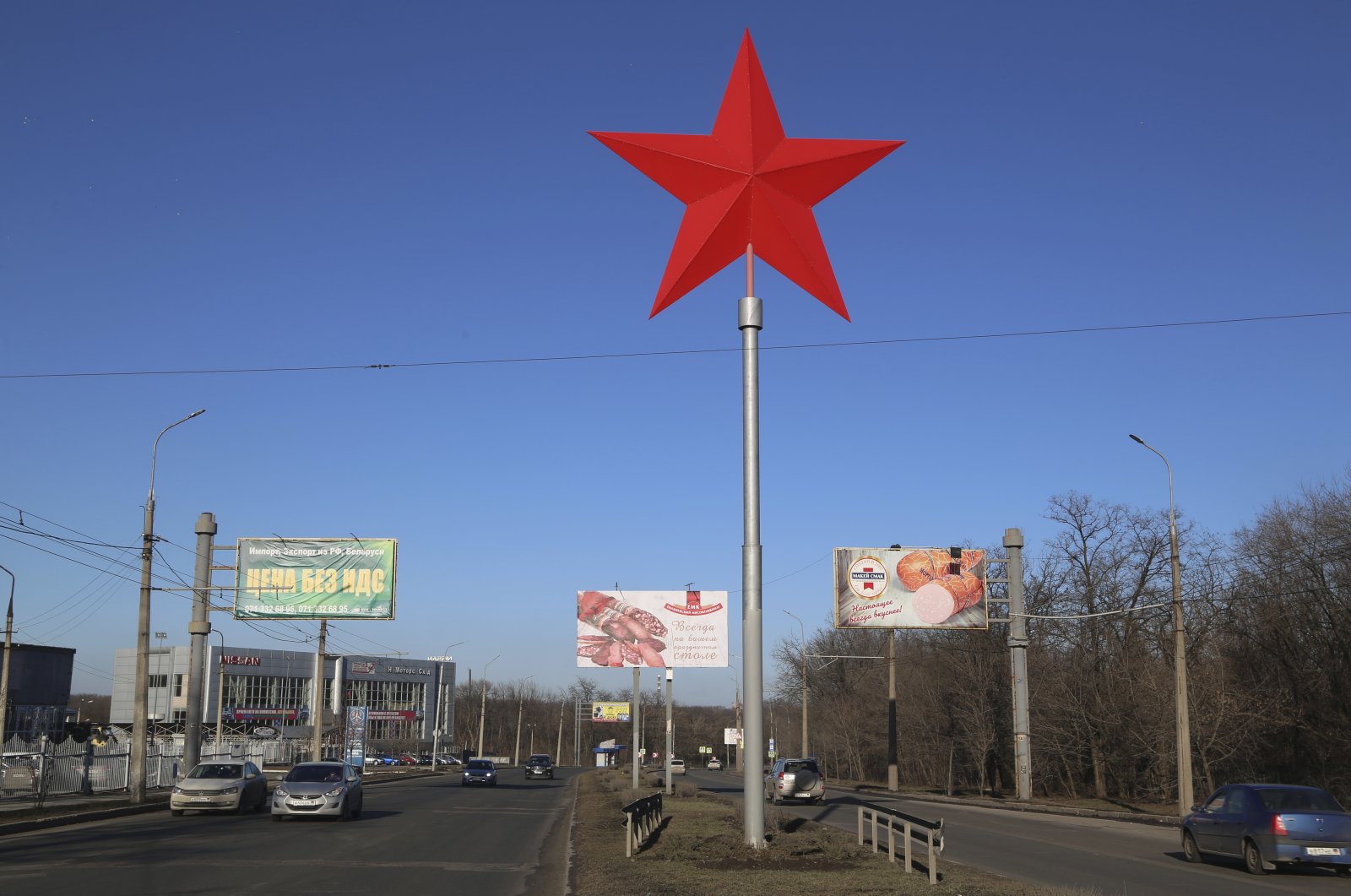 A huge red star rises over a street in Donetsk, the territory controlled by pro-Russian militants, eastern Ukraine, Monday, Feb. 14, 2022. (AP Photo)