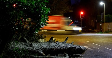 A fallen tree lies across a road after Storm Eunice, in Leatherhead, Britain, Feb. 18, 2022. (Reuters Photo)