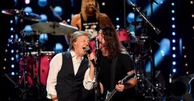Sir Paul McCartney performs the Beatles song "Get Back" with the Foo Fighters after they were inducted into the Rock and Roll Hall of Fame in Cleveland, Ohio, U.S., Oct. 31, 2021. (REUTERS)