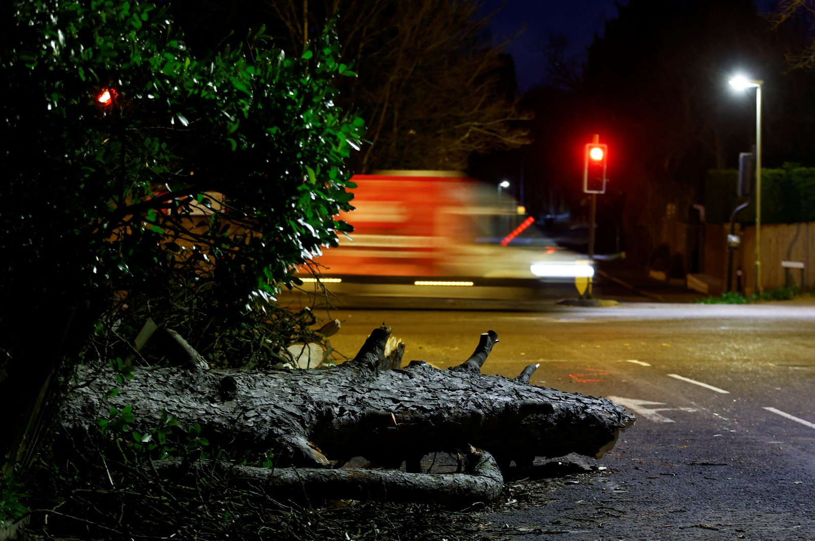 A fallen tree lies across a road after Storm Eunice, in Leatherhead, Britain, Feb. 18, 2022. (Reuters Photo)