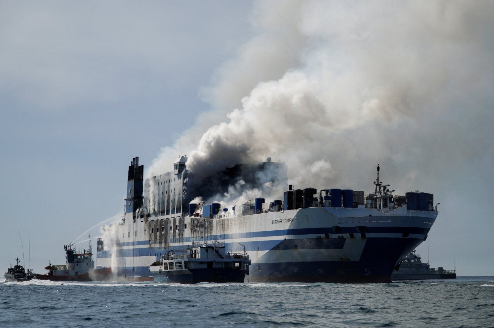 Smoke rises from the burning Italian-flagged Euroferry Olympia after a fire broke out on the ferry, off the island of Corfu, Greece, Feb. 18, 2022. (Reuters Photo)