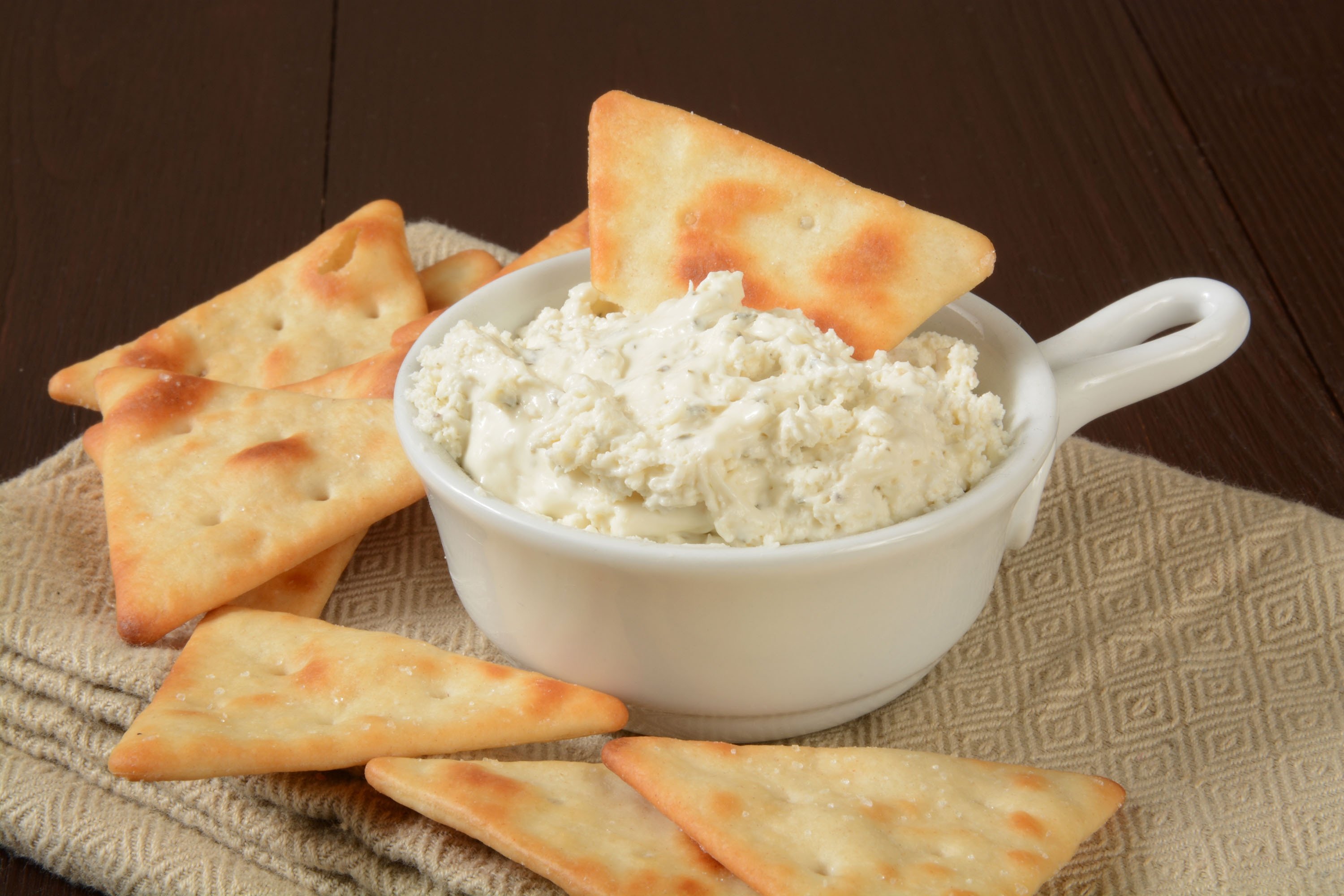 You can pair your plain crackers with a cream cheese dip. (Shutterstock)