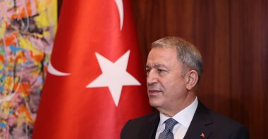Defense Minister Hulusi Akar addresses reporters on the sidelines of the Munich Security Conference, Munich, Germany, Feb. 20, 2022. (AA Photo)