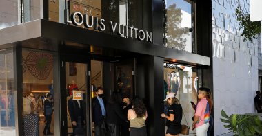 People wait to enter the Louis Vuitton store in Miami Design District, Miami, Florida, U.S., Nov. 30, 2021. (Reuters Photo)