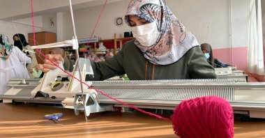 Women knit clothes for children Afghanistan and Syria at the Public Education Center in eastern Elazığ province&#039;s Baskil district, Turkey, Feb. 20, 2022. (AA Photo)
