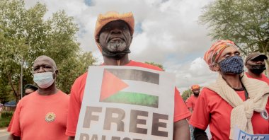 Members of General Industrial Workers Union of South Africa (GIWUSA), civil associations and political parties hold anti-Israel banners during a pro-Palestine demonstration in front of the Israeli Trade and Economic Office in Sandton, Johannesburg, Jan. 27, 2022. (AFP File Photo)