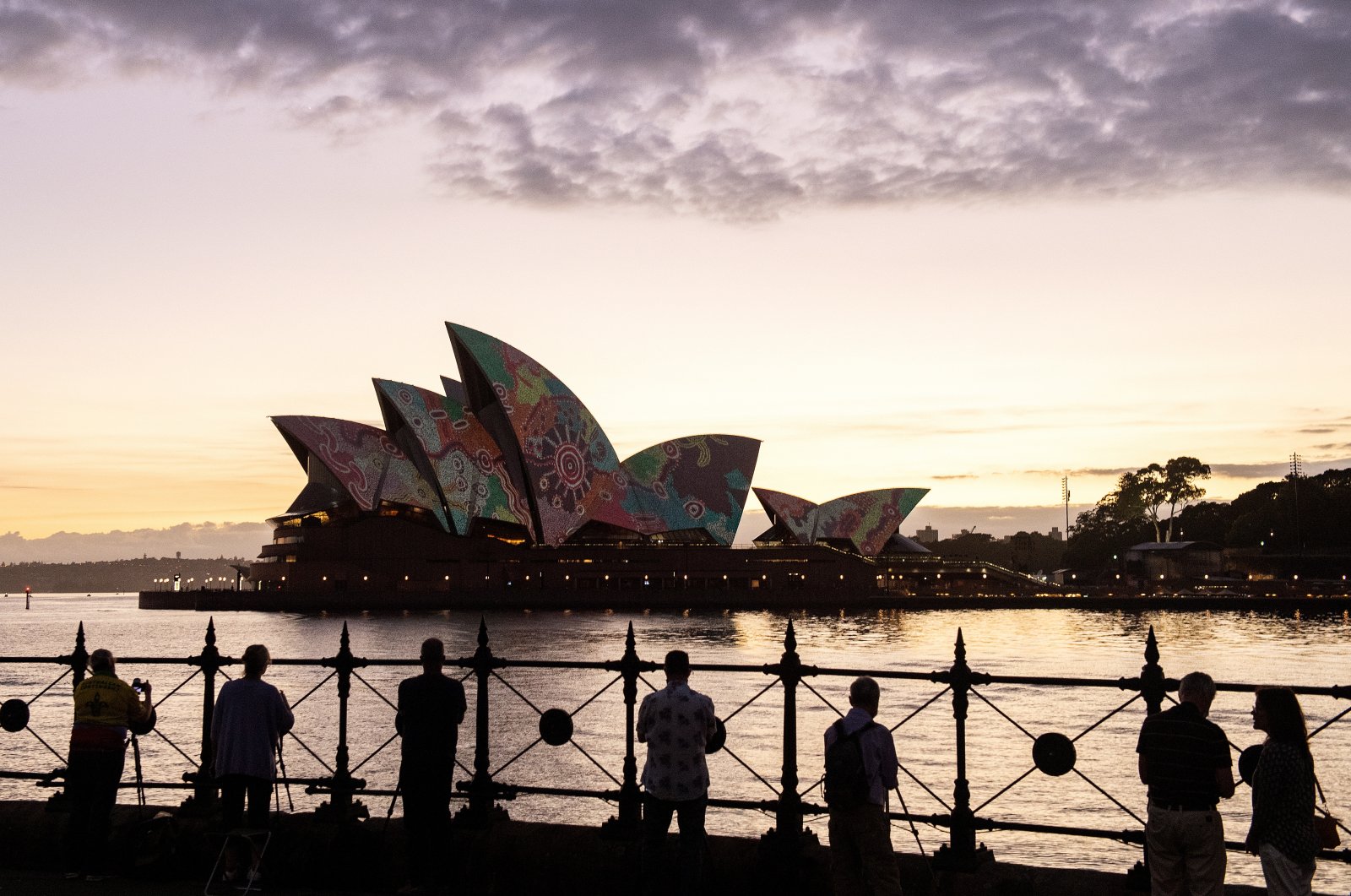 Artwork by Pitjantjatjara man Yadjidta David Miller is projected onto the sails of the Sydney Opera House at dawn during Australia Day 2022 celebrations in Sydney, Australia, Jan. 26, 2022.  (EPA Photo)