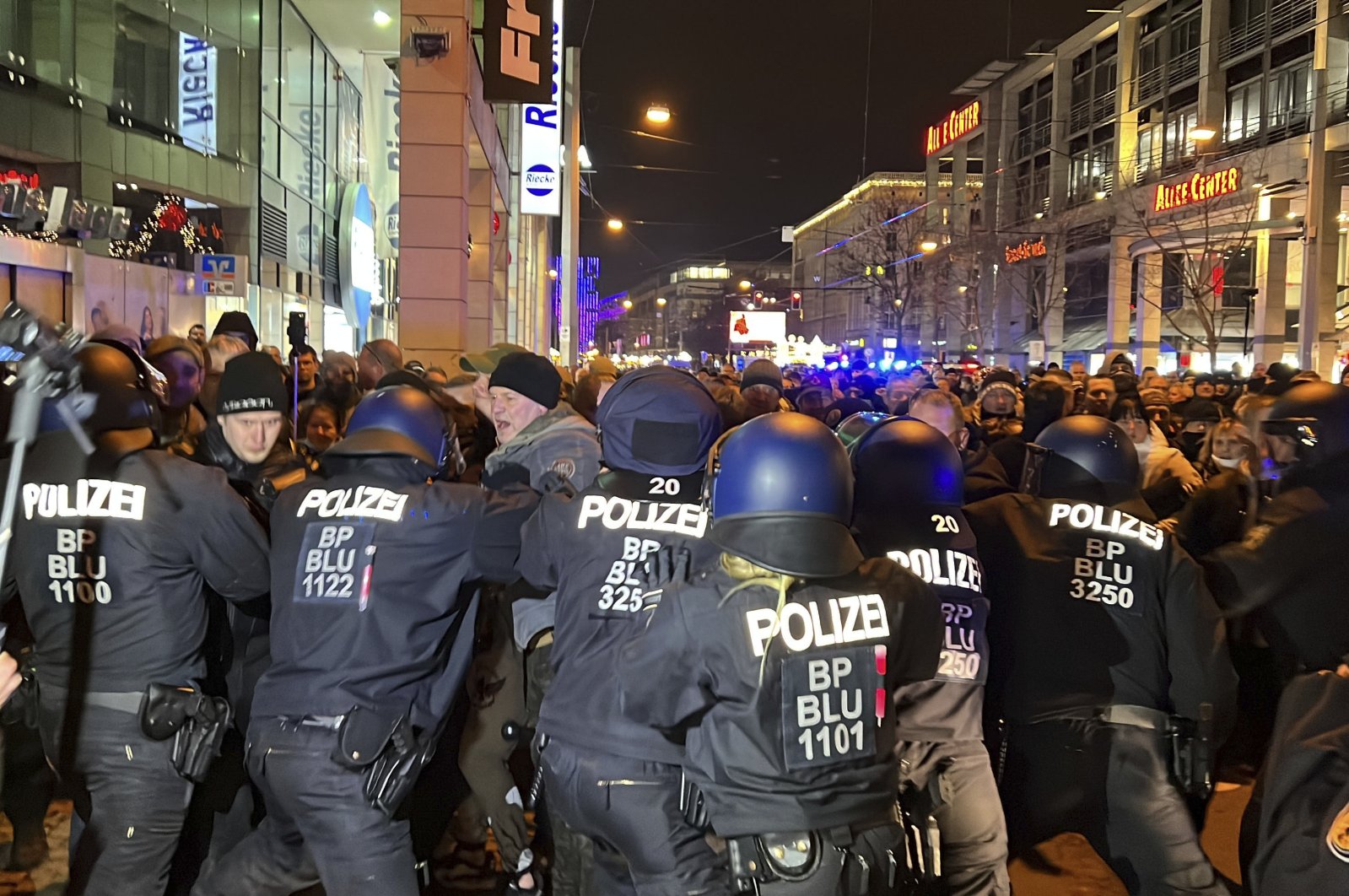 Protestors and police clash during a protest against COVID-19 measures in Magdeburg, Germany, Jan. 24, 2022. (AP Photo)
