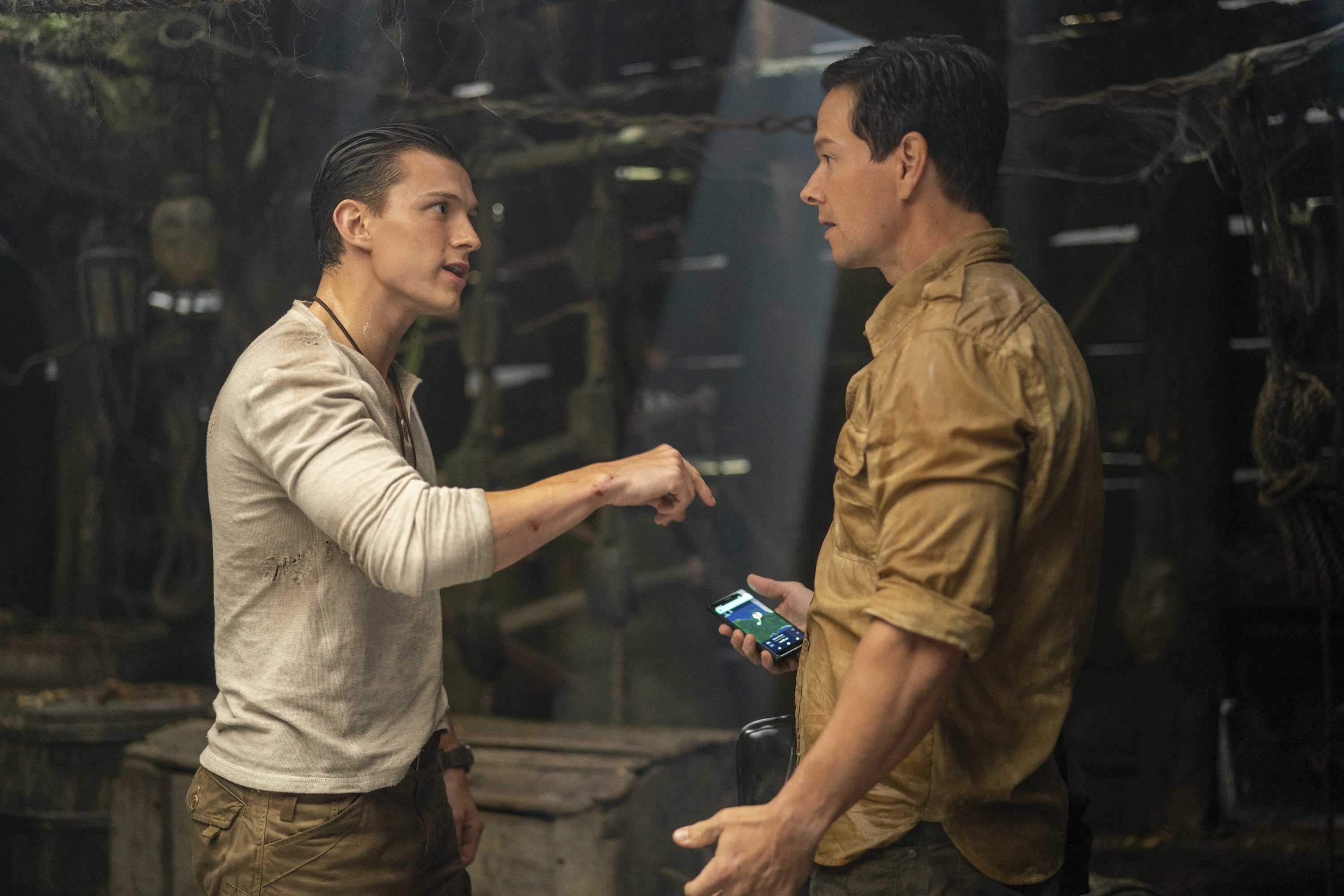 Mark Wahlberg (R) and Tom Holland appear in a scene from "Uncharted." (AP Photo)