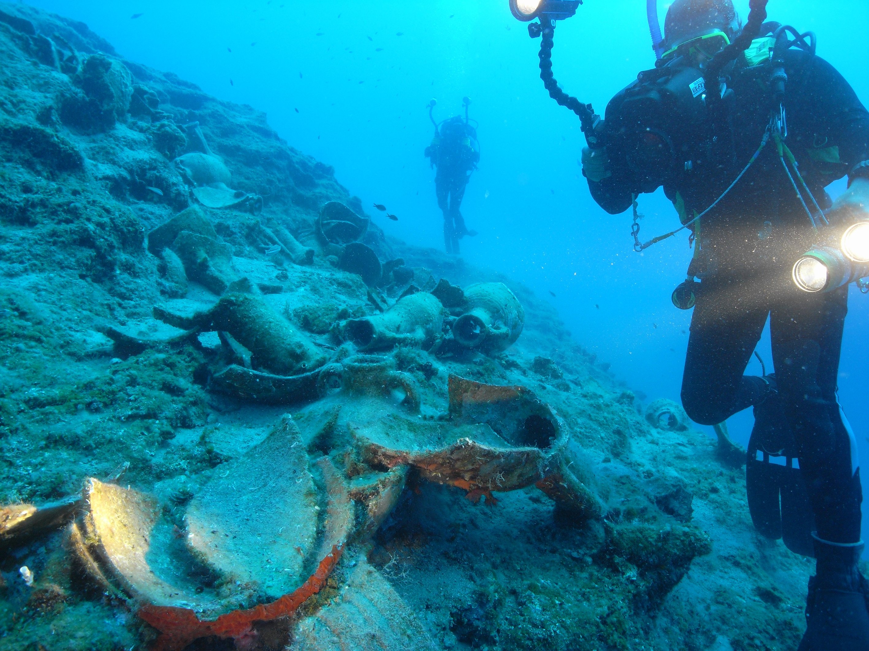 A researcher records amphorae found in the Rhodes shipwreck in the Gulf of Fethiye, southwestern Turkey, Feb. 20, 2022. (AA Photo)