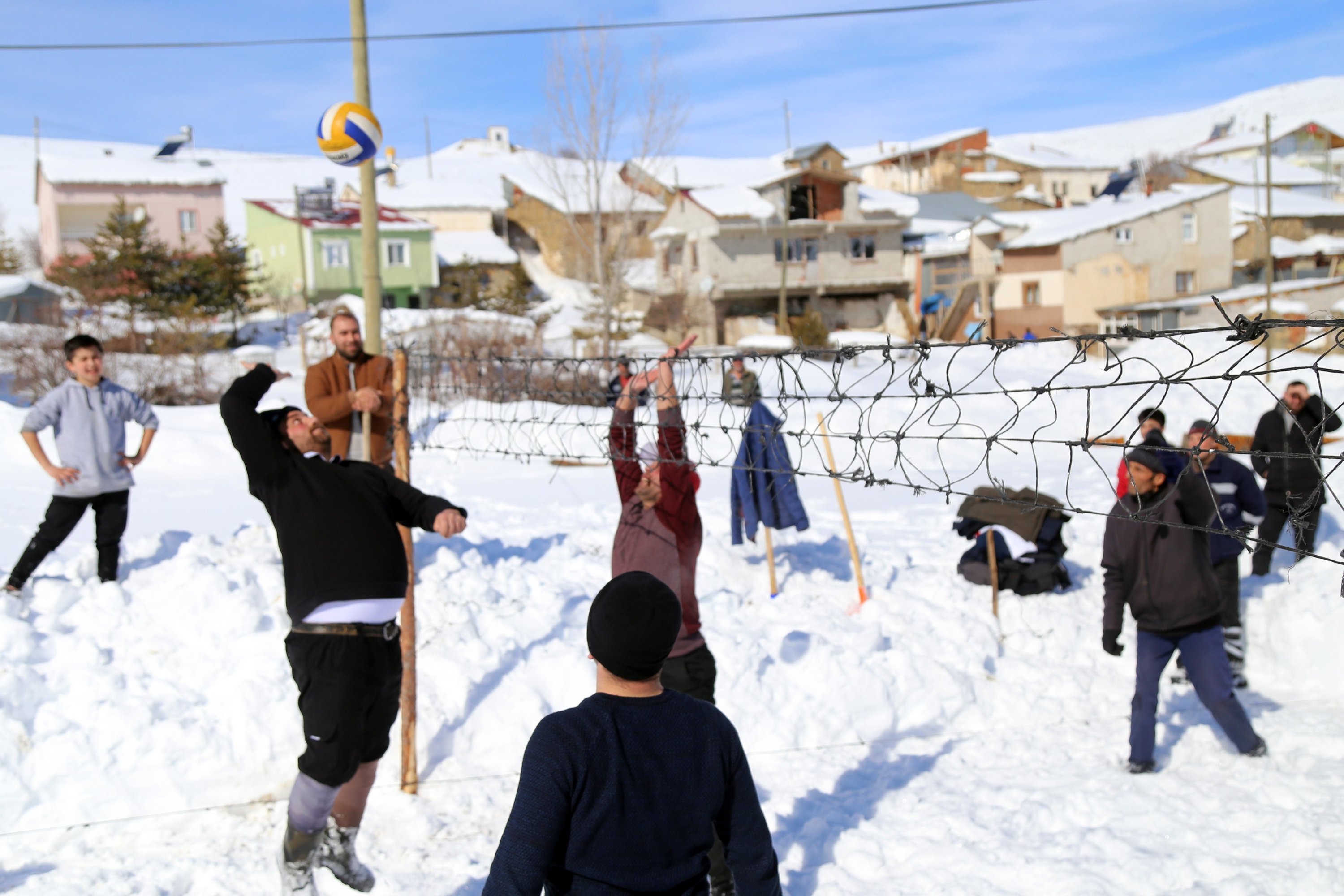 Local people in Yenice village play snow volleyball, Gümüşhane, Turkey, Feb. 21, 2022. (IHA Photo)