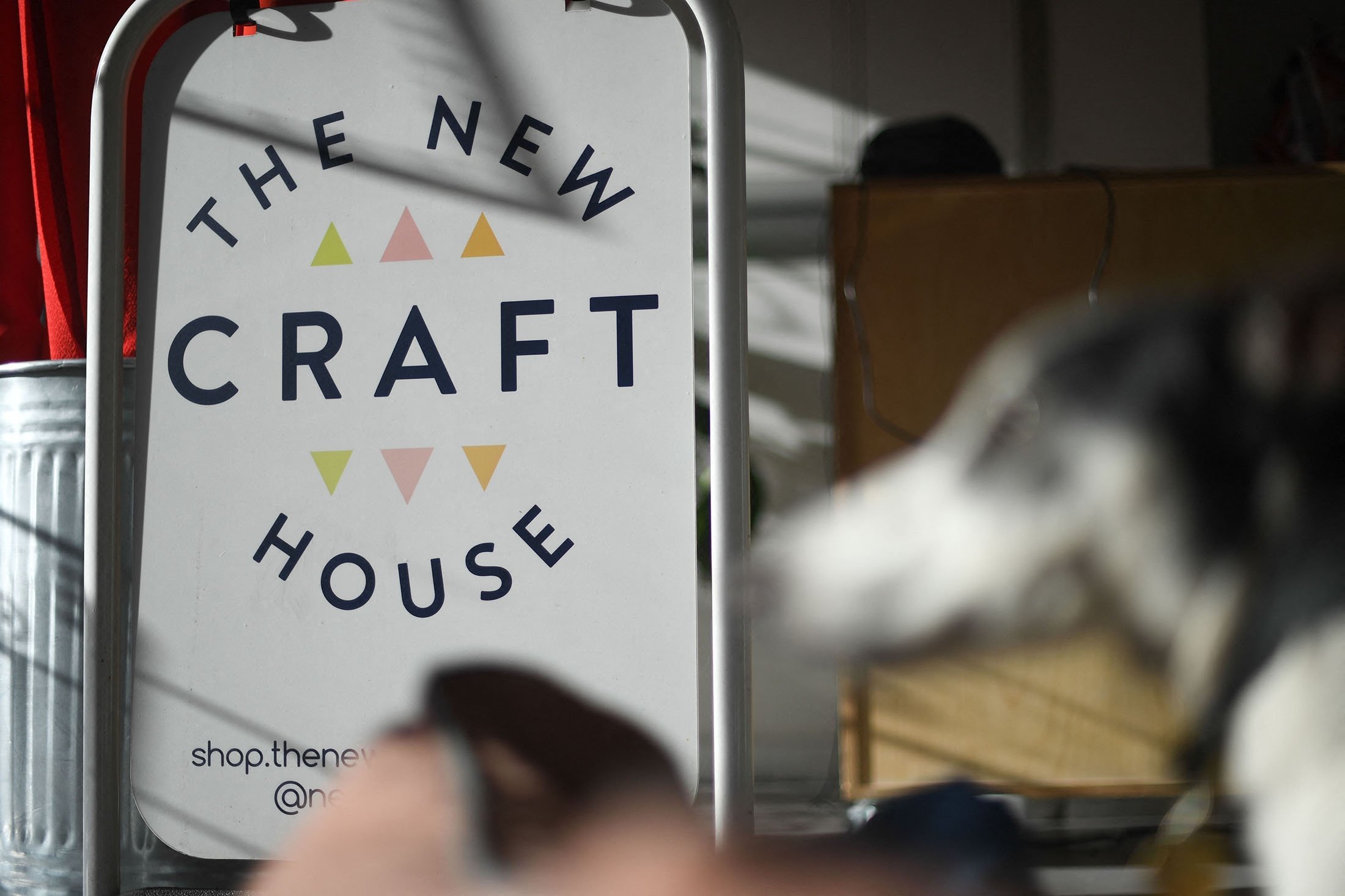 The shop sign displayed at the New Craft House, a sewing workshop studio and designer deadstock fabric shop, in Hackney, East London, U.K., Feb. 11, 2022. (AFP Photo)