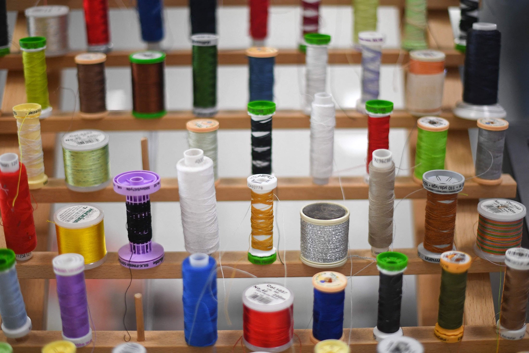 Thread rolls displayed at The New Craft House, a sewing workshop studio and designer deadstock fabric shop, in Hackney, East London, U.K., Feb. 11, 2022. (AFP Photo)