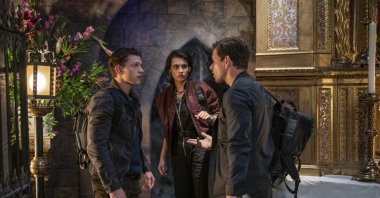 From left, Tom Holland, Sophia Taylor Ali and Mark Wahlberg appear in a scene from "Uncharted." (AP Photo)